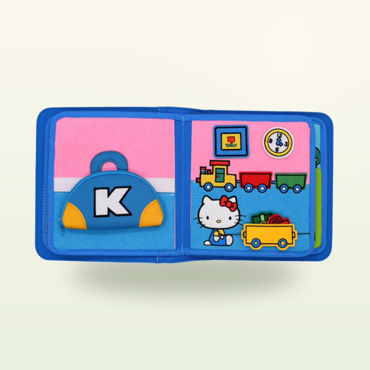 Doble página de compras del quiet book Hello Kitty sobre fondo suave de color crema – a partir de 1 año