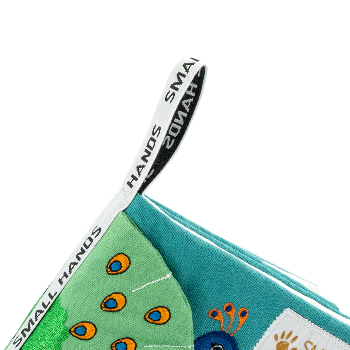 Small Hands Birds cloth book: close-up of the woven grasping loop with Small Hands lettering on the spine – baby book detail
